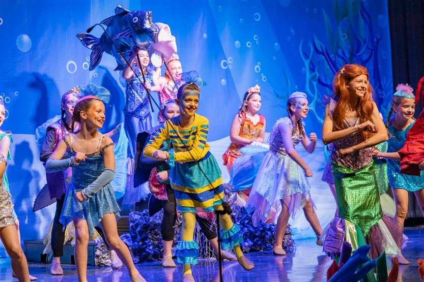Students perform onstage